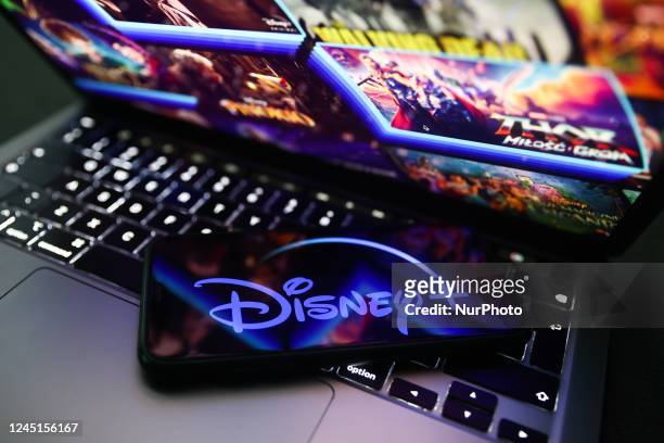 Disney+ logo displayed on a phone screen and Disney+ website displayed on a laptop screen are seen in this illustration photo taken in Krakow, Poland...