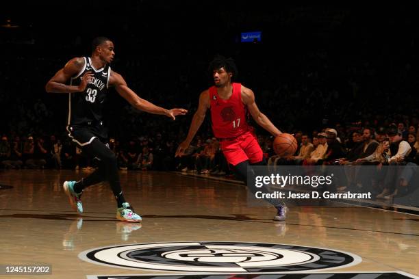 Shaedon Sharpe of the Portland Trail Blazers dribbles the ball during the game against the Brooklyn Nets on November 27, 2022 at Barclays Center...