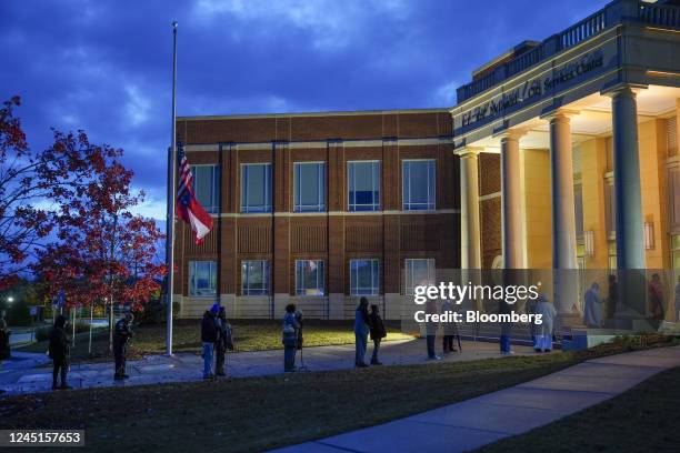 Voters wait in line to cast ballots at a polling location in Columbus, Georgia, US, on Sunday, Nov. 27, 2022. Democratic US Senator Raphael Warnock...