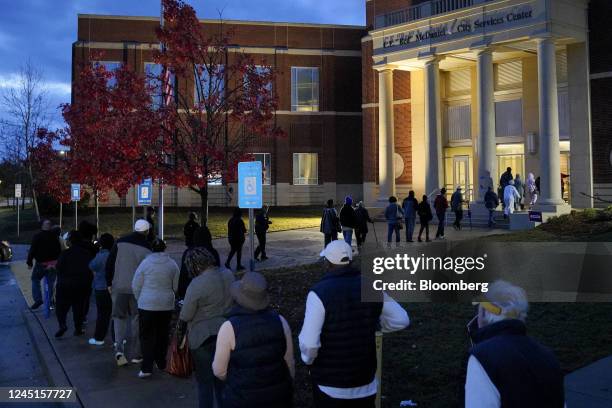 Voters wait in line to cast ballots at a polling location in Columbus, Georgia, US, on Sunday, Nov. 27, 2022. Democratic US Senator Raphael Warnock...