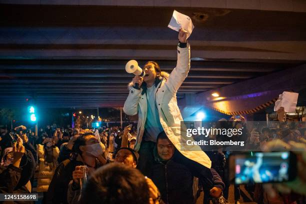 Demonstrator holds a blank sign and chants slogans during a protest in Beijing, China, on Monday, Nov. 28, 2022. Protests against Covid restrictions...