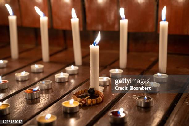 Candles lit to mourn the victims of the Urumqi fire during a vigil in Beijing, China, on Sunday, Nov. 27, 2022. Protests against Covid restrictions...