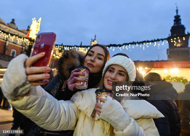 View of Christmas decorations at the crowded Christmas Market on the Main Market Square in Krakow. On Sunday, November 27 in Krakow, Lesser Poland...