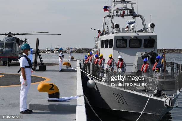 Philippine navy personnel stand in formation aboard the BRP Nestor Acero , a fast attack interdiction craft-missile gunboat acquired from Israeli...