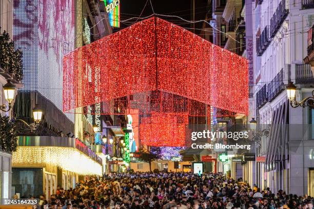 Crowds of shoppers under festive lights on the pedestrianized shopping street Preciados, in central Madrid, Spain, on Friday, Nov. 25, 2022. European...