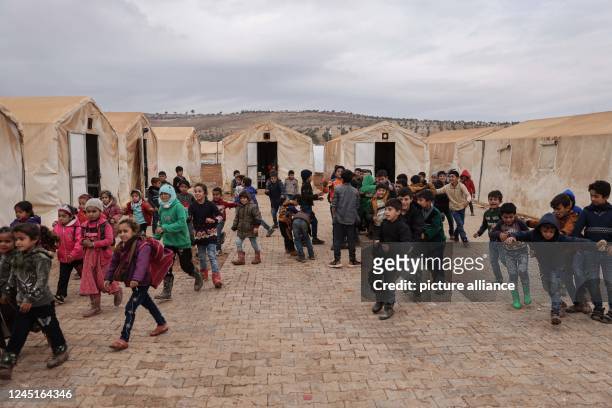 November 2022, Syria, Azaz: Syrian children play in the school yard of Bersaya refugee camp near the Bab al-Salama border crossing with Turkey in the...