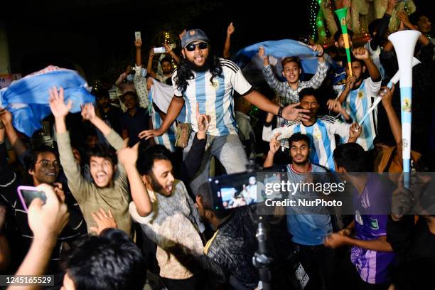 Bangladeshi football fans celebrate Argentina's victory against Mexico at the Dhaka University Area in Dhaka, Bangladesh on 27, 2022.