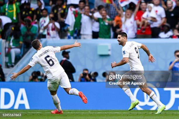Aleksandar Mitrovic of Serbia celebrates after scoring his sides third goal with Nemanja Maksimovic of Serbia during the Group G - FIFA World Cup...