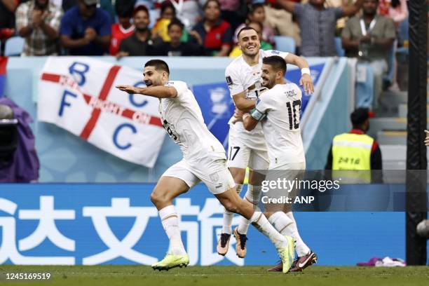 Aleksandar Mitrovic of Serbia, Filip Kostic of Serbia, Dusan Tadic of Serbia celebrate the 1-3 during the FIFA World Cup Qatar 2022 group G match...