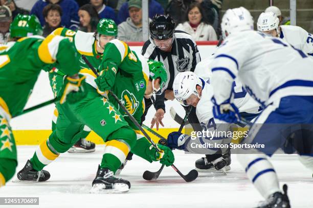 Minnesota Wild center Joel Eriksson Ek takes a faceoff against Toronto Maple Leafs center David Kampf during the NHL game between the Toronto Maple...