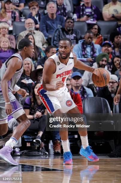 Alec Burks of the Detroit Pistons posts up DeAaron Fox of the Sacramento Kings on November 20, 2022 at Golden 1 Center in Sacramento, California....