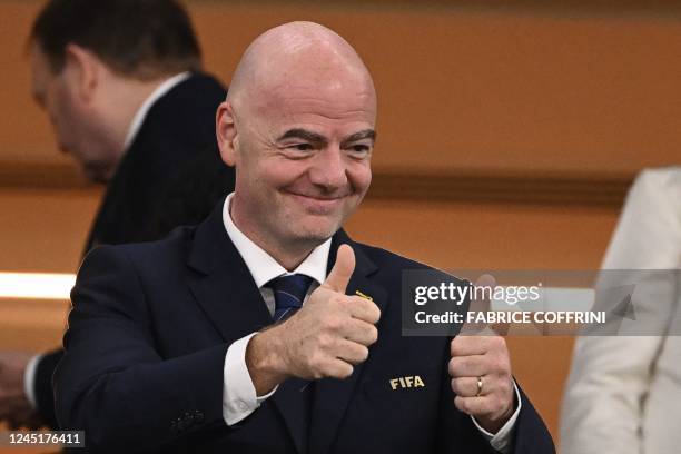 President Gianni Infantino gives thumbs-up during the Qatar 2022 World Cup Group G football match between Brazil and Switzerland at Stadium 974 in...