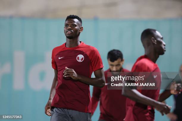 Qatar's forward Mohammed Muntari takes part in a training session at the Aspire Zone Training Site in Doha on November 28 on the eve of the Qatar...