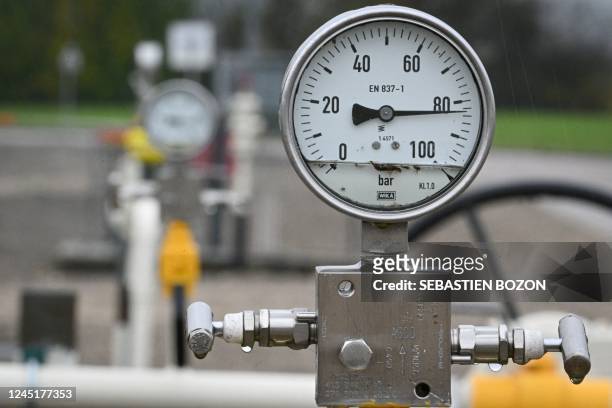 Picture taken on November 28 shows a pressure gauge on gas pipes at a GRTgaz compressor station, in Morelmaison, eastern France. - A compressor...