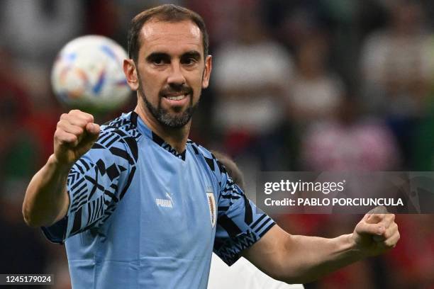 Uruguay's defender Diego Godin gestures during warm up ahead of the Qatar 2022 World Cup Group H football match between Portugal and Uruguay at the...