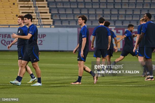 S players attend a training session at Al Gharafa SC in Doha on November 28 on the eve of the Qatar 2022 World Cup football match between Iran and...