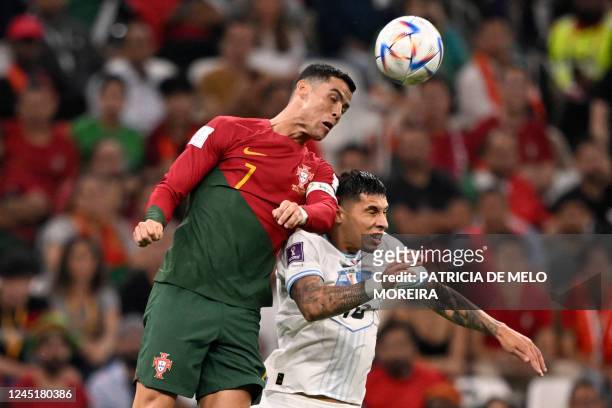 Portugal's forward Cristiano Ronaldo heads the ball past Uruguay's defender Mathias Olivera during the Qatar 2022 World Cup Group H football match...