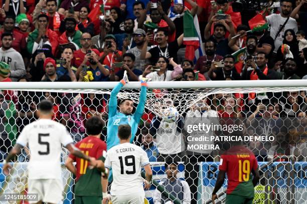 Uruguay's defender Martin Caceres jumps to deflects a ball during the Qatar 2022 World Cup Group H football match between Portugal and Uruguay at the...