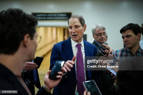 Sen. Ron Wyden talks to reporters in the Senate subway on his way to a procedural vote on the Respect For Marriage Act at the U.S. Capitol on...