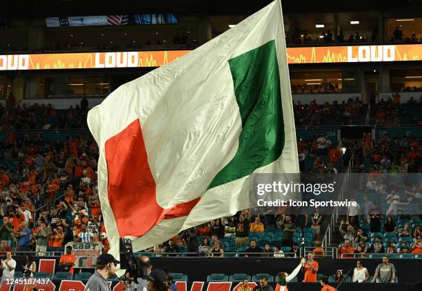 Miami Hurricanes cheer squad member carries the school logo during the college football game between the Pittsburgh Panthers and the Miami Hurricanes...