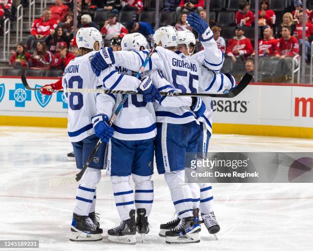 Mitchell Marner of the Toronto Maple Leafs celebrates a goal with teammates during second period of an NHL game against the Detroit Red Wings at...