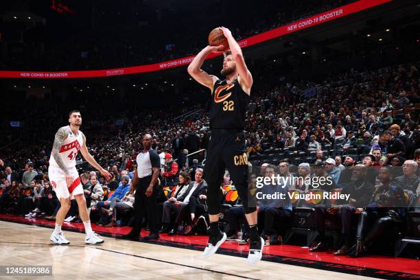 Dean Wade of the Cleveland Cavaliers shoots a three point basket during the game against the Toronto Raptors on November 28, 2022 at the Scotiabank...