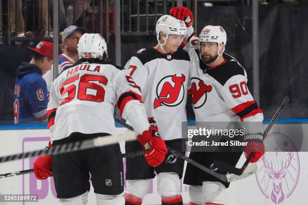 Yegor Sharangovich of the New Jersey Devils celebrates with teammates after scoring a goal in the third period against the New York Rangers at...