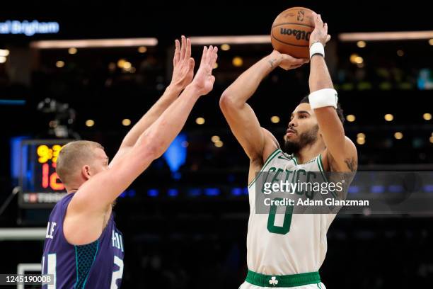 Jayson Tatum of the Boston Celtics shoots the ball over Mason Plumlee of the Charlotte Hornets during a at TD Garden on November 28, 2022 in Boston,...