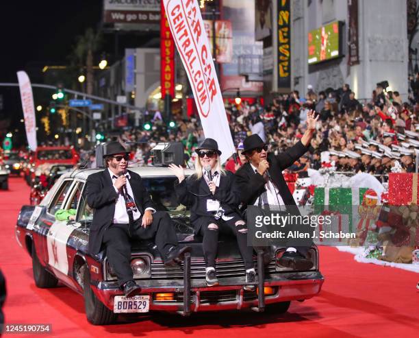 Hollywood, CA The Blues Brothers ride on the hood of a bluesmobile police car from Nate Truman, founder of Star Car Central during The 90th...