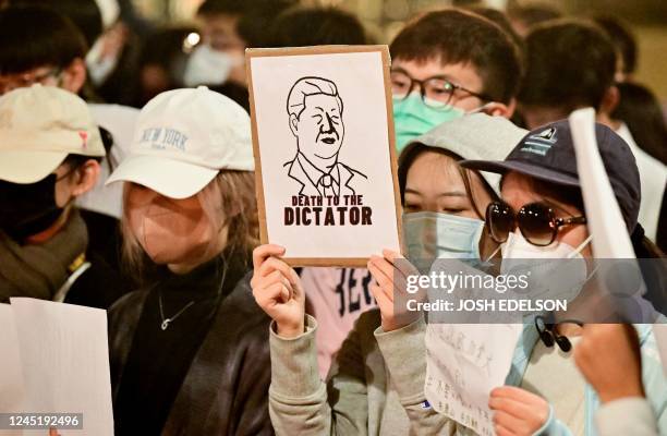 People gather to protest the Chinese governments continued continued zero-Covid policies at the University of California Berkeley campus in Berkeley,...