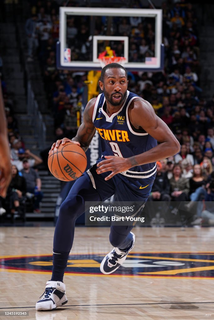 Davon Reed of the Denver Nuggets dribbles the ball during the game ...