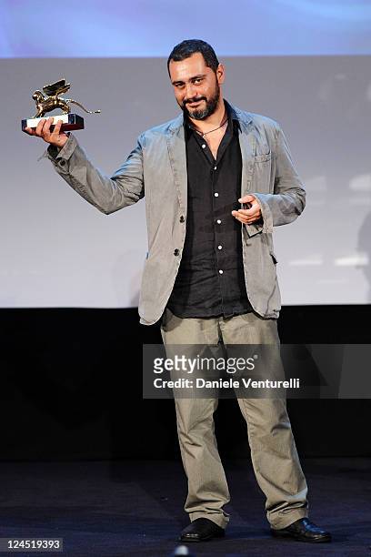 Guido Lombardi accepts The Lion of the Future for best first work for "La Bas. A Criminal Education" during the Closing Ceremony Inside during the...