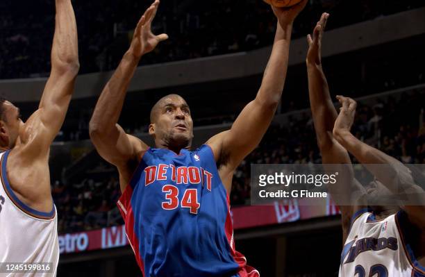 Corliss Williamson of the Detroit Pistons drives to the hoop against the Washington Wizards on November 29, 2003 at the MCI Center in Washington, DC....