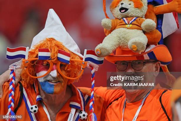 Netherlands fans attend the Qatar 2022 World Cup Group A football match between the Netherlands and Qatar at the Al-Bayt Stadium in Al Khor, north of...