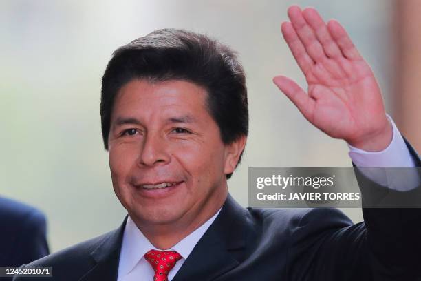 Peruvian President Pedro Castillo waves on his arrival to La Moneda presidential palace in Santiago, on November 29 during his visit to Chile.