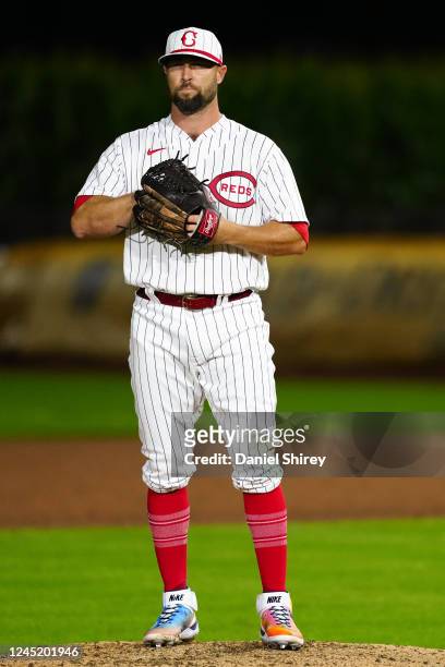 Hunter Strickland of the Cincinnati Reds pitches during the game between the Chicago Cubs and the Cincinnati Reds at The MLB Field at Field of Dreams...