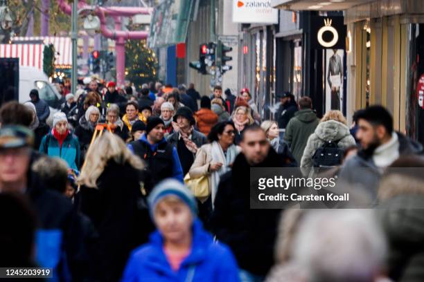 People walk passing stores at Tauentzienstrasse on November 29, 2022 in Berlin, Germany. Retailers across Germany are hoping for a strong consumer...