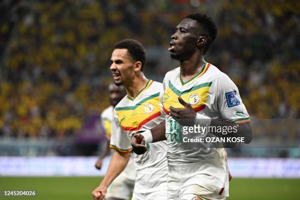 Senegal's forward Ismaila Sarr celebrates scoring his team's first goal during the Qatar 2022 World Cup Group A football match between Ecuador and...