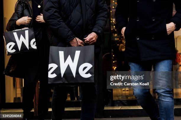 People carry shopping bags of the KADEWE store on November 29, 2022 in Berlin, Germany. Retailers across Germany are hoping for a strong consumer...