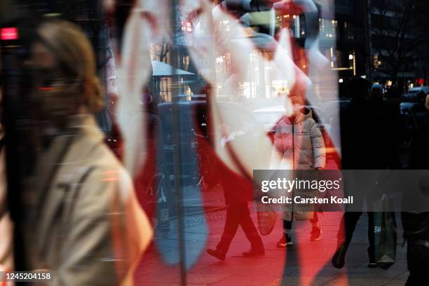 People walk past a Christmas shopping display at a store on November 29, 2022 in Berlin, Germany. Retailers across Germany are hoping for a strong...