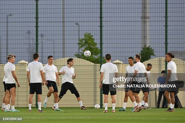 Denmark's defender Joakim Maehle and teammates take part in a training session at the Al Sailiya SC training site in Doha on November 29 on the eve...