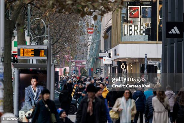 People walk passing stores at Tauentzienstrasse on November 29, 2022 in Berlin, Germany. Retailers across Germany are hoping for a strong consumer...