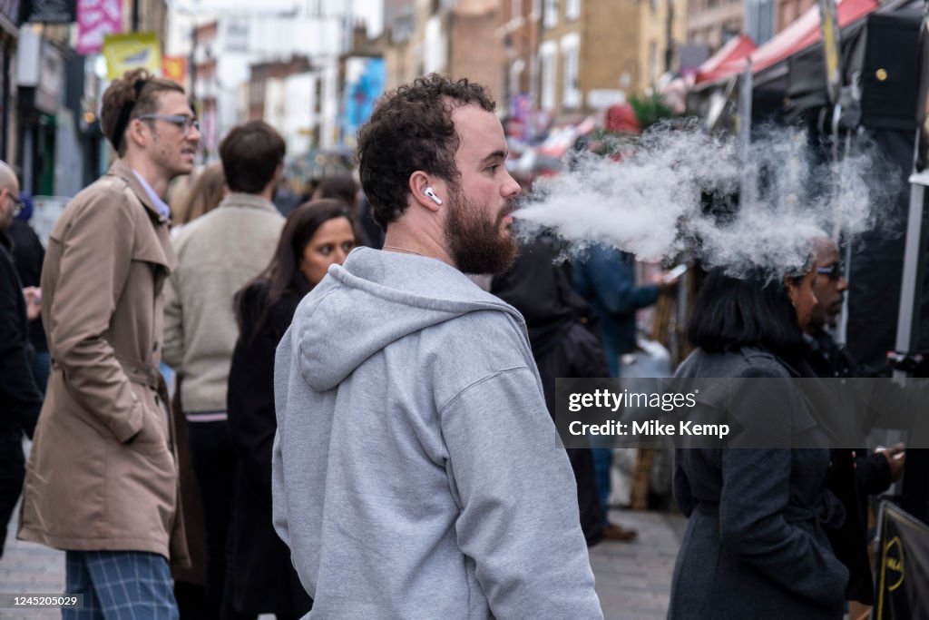 British Rapper Vaping Man vaping on the street on 17th November 2022 in London, United ...
