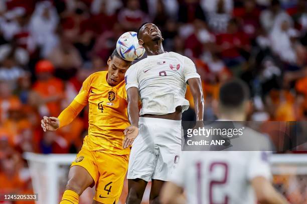 Virgil van Dijk of Holland and Mohammed Muntari of Qatar during the FIFA World Cup Qatar 2022 group A match between the Netherlands and Qatar at Al...