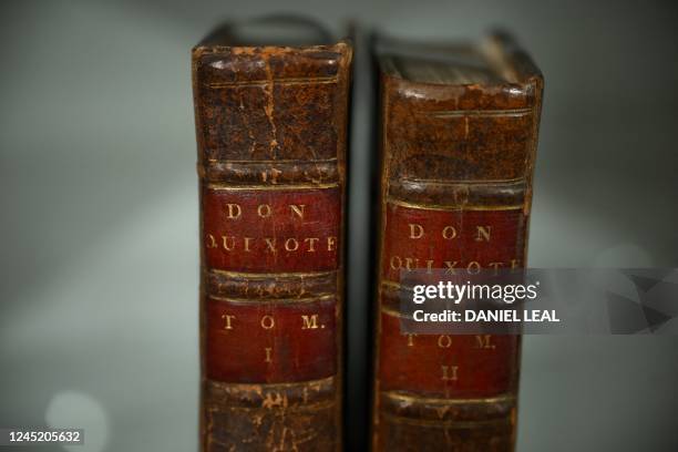 Two volumes of Miguel de Cervantes's 'Don Quixote' novel, are pictured at Sotheby's auction house in central London on November 25 ahead of their...