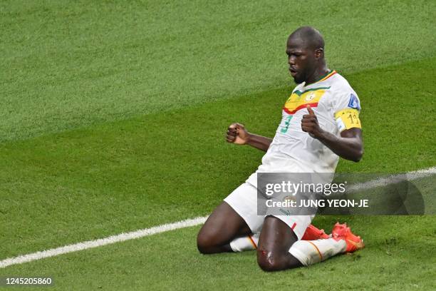 Senegal's defender Kalidou Koulibaly celebrates scoring his team's second goal during the Qatar 2022 World Cup Group A football match between Ecuador...