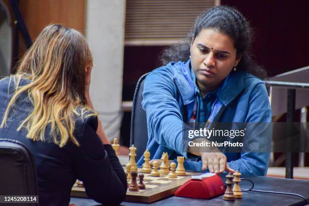 Koneru Humpy of India taps on the clock during a rapid chess match against Anna Ushenina of Ukraine at the fourth edition of Tata Steel Chess India...