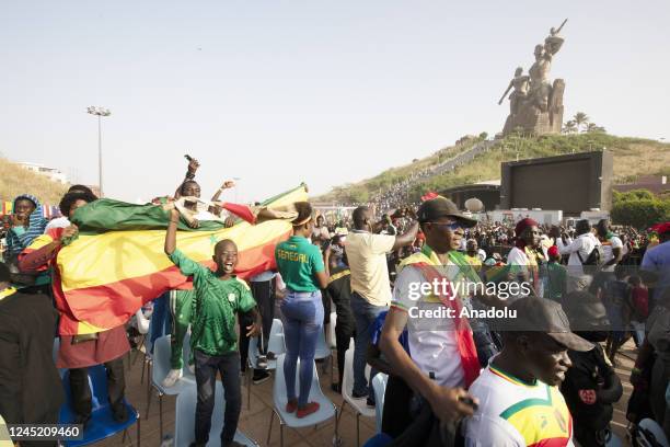 Senegalese people celebrate after Senegal qualifies to round 16 by defeating Ecuador in the FIFA World Cup Qatar 2022 Group A match, near renaissance...