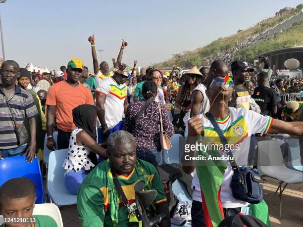 Senegalese people celebrate after Senegal qualifies to round 16 by defeating Ecuador in the FIFA World Cup Qatar 2022 Group A match, near renaissance...