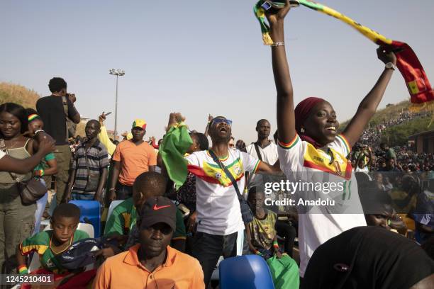 Senegalese people celebrate after Senegal qualifies to round 16 by defeating Ecuador in the FIFA World Cup Qatar 2022 Group A match, near renaissance...